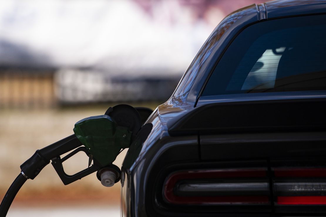 A vehicle refuels at a gas station in Washington, DC, in November 2023.