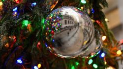 The New York Stock Exchange (NYSE) is reflected in a Christmas ornament in New York on December 1, 2023. (Photo by ANGELA WEISS / AFP) (Photo by ANGELA WEISS/AFP via Getty Images)