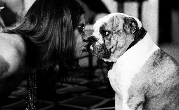 Osbourne smooches his dog in 1991.