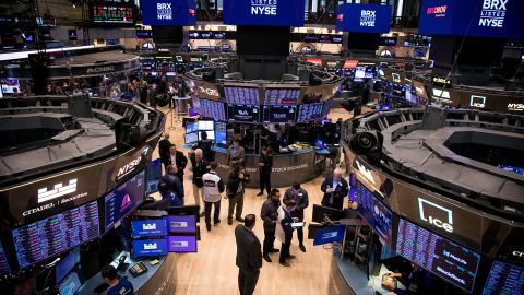 Traders work on the floor of the New York Stock Exchange (NYSE) in New York, US, on Monday, Dec. 4, 2023. Stocks and bonds retreated as traders pause after Novembers blockbuster rally and debate the case for interest rate cuts.