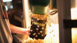 Dillon Smith gets popcorn for customers in the concession stand at the TK/Starlite Drive-In Theater on September 28, 2013 in Neligh, Nebraska. The theater, which opened in 1952, is one of only two drive-in theaters left in Nebraska, a state that once had almost 50. At the peak of their popularity in the late 1950s there were between 4 and 5 thousand drive-in theaters in the United States, there are now only about 350. As movie studios begin to phase out distribution of 35mm film prints in favor of digital media, the high cost drive-in theaters face when switching to a digital projection system is expected to force more of these theaters to close. The TK/ Starlite installed a digital projector earlier this year.