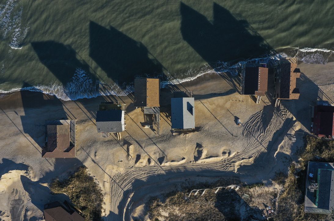 Pictured on January 6, 2023, in Rodanthe, North Carolina, the beachfront home on the far left was felled by Atlantic Ocean waves on March 13, 2023.