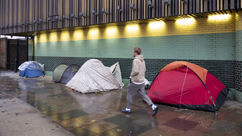 Homeless persons tents pitched in line on the pavement in Whitechapel on 5th December 2023 in East London, United Kingdom. The scene is illustrative of the social disparity in the UK with some people who live in relative wealth in comparison to others, and is an ever common sight in the capital, as people struggle with the cost of living crisis and mental health issues.