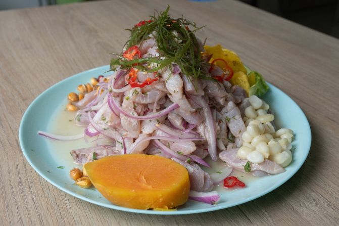 At number three on the list is Lima, Peru, where visitors are advised to try ceviche and arroz con pollo (chicken and rice). Pictured here: a traditional sea bass ceviche dish cooked by Peruvian chef Roberto Madrid at his restaurant Aroma de Mar in Lima, Peru.