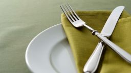 Close-up shot of green table setting with copy space,