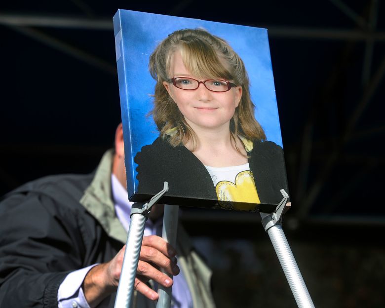 A photograph of Jessica is place prominently up on a stage for a dedication ceremony at Jessica Ridgeway Memorial Park in Westminster on October 5, 2013.