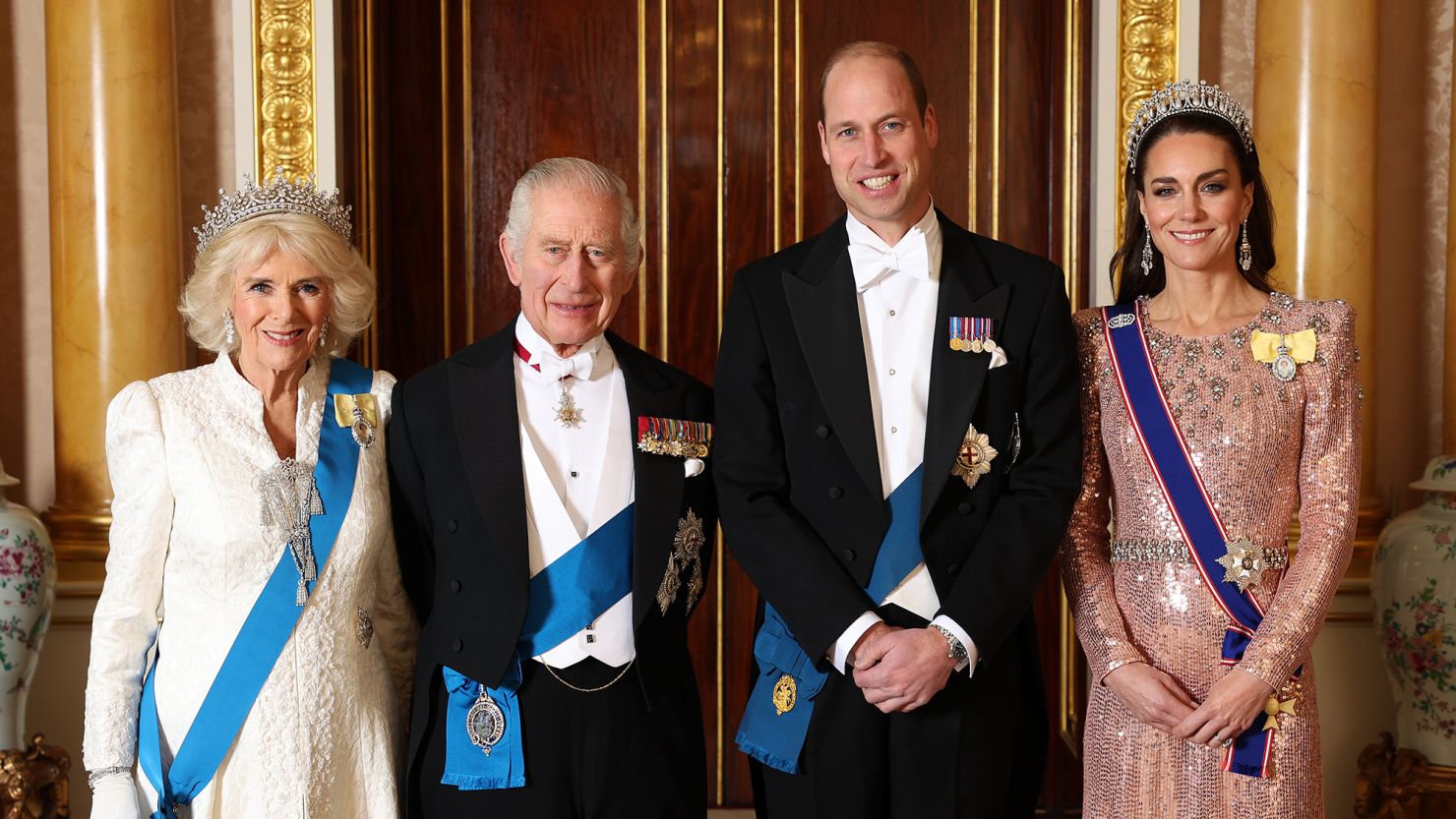 King Charles and Queen Camilla pose with the Prince and Princess of Wales ahead of the Diplomatic Reception in the 1844 Room at Buckingham Palace on December 5.
