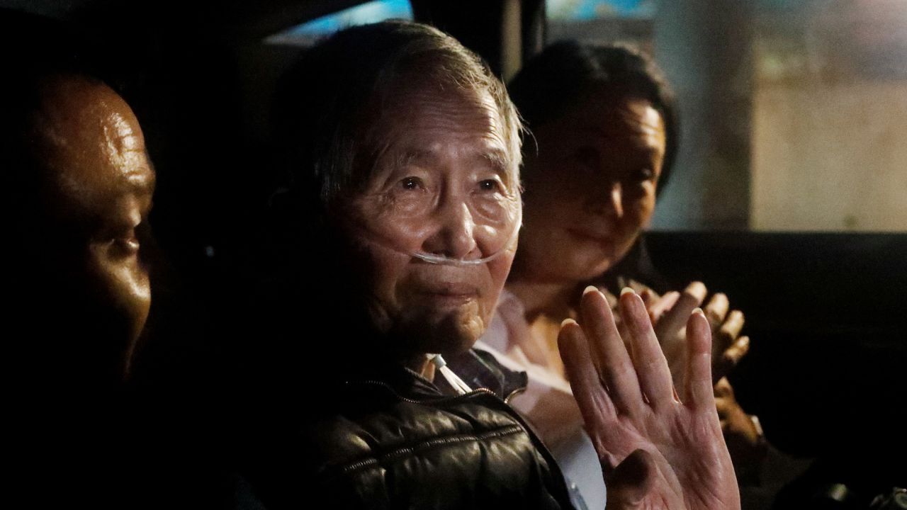 LIMA, PERU - DECEMBER 06: Former president of Peru Alberto Fujimori exits in a car the Barbadillo prison after being released on December 06, 2023 in Lima, Peru. On Tuesday, Peru's Constitutional Tribunal ordered the immediate release of former president Alberto Fujimori who is serving a 25 years sentence in connection with the death squad slayings of 25 Peruvians in the 1990s. This pardon request was appealed by the Inter-American Commission on Human Rights. (Photo by Mariana Bazo/Getty Images)