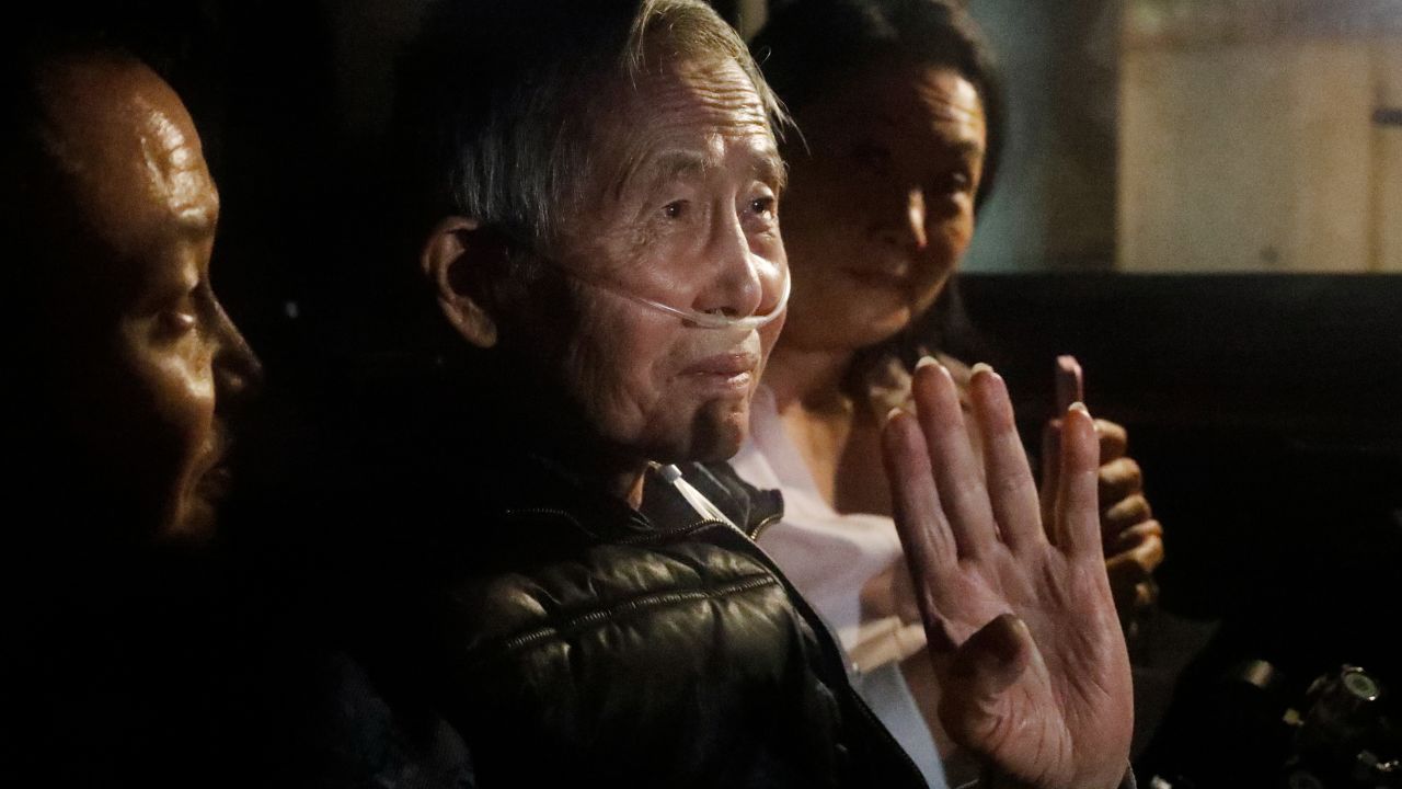 LIMA, PERU - DECEMBER 06: Former president of Peru Alberto Fujimori exits in a car the Barbadillo prison after being released on December 06, 2023 in Lima, Peru. On Tuesday, Peru's Constitutional Tribunal ordered the immediate release of former president Alberto Fujimori who is serving a 25 years sentence in connection with the death squad slayings of 25 Peruvians in the 1990s. This pardon request was appealed by the Inter-American Commission on Human Rights. (Photo by Mariana Bazo/Getty Images)