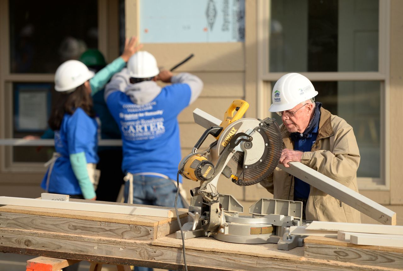 Former president Jimmy Carter works on building a home during Habitat for Humanity's Carter Work Project event in the Globeville Neighborhood in Denver in 2013.