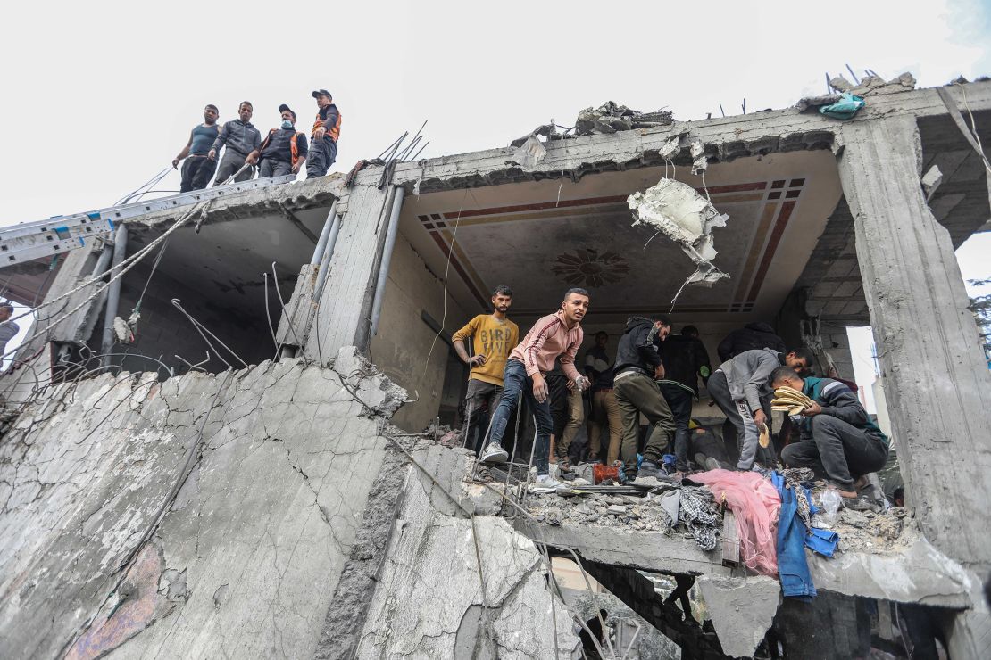 Palestinians carry out search and rescue operations following an airstrike on December 7, 2023, in Khan Younis.