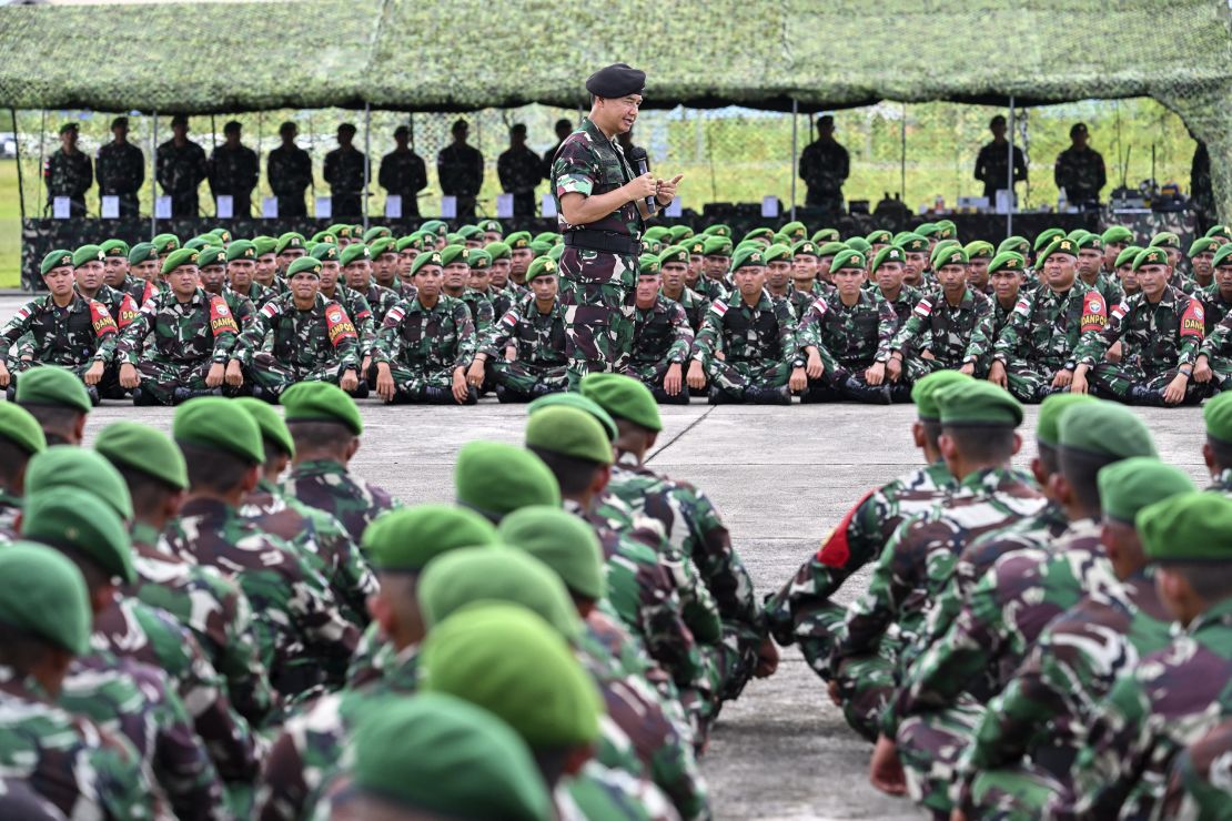 Indonesian soldiers at the Sultan Iskandar Muda Airforce base in Aceh province are briefed before being deployed to West Papua for security operations.