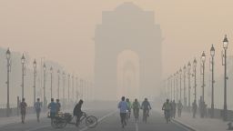 Morning walkers seen during a cold and hazy morning at Kartavya Path near India Gate on December 9, 2023 in New Delhi, India.