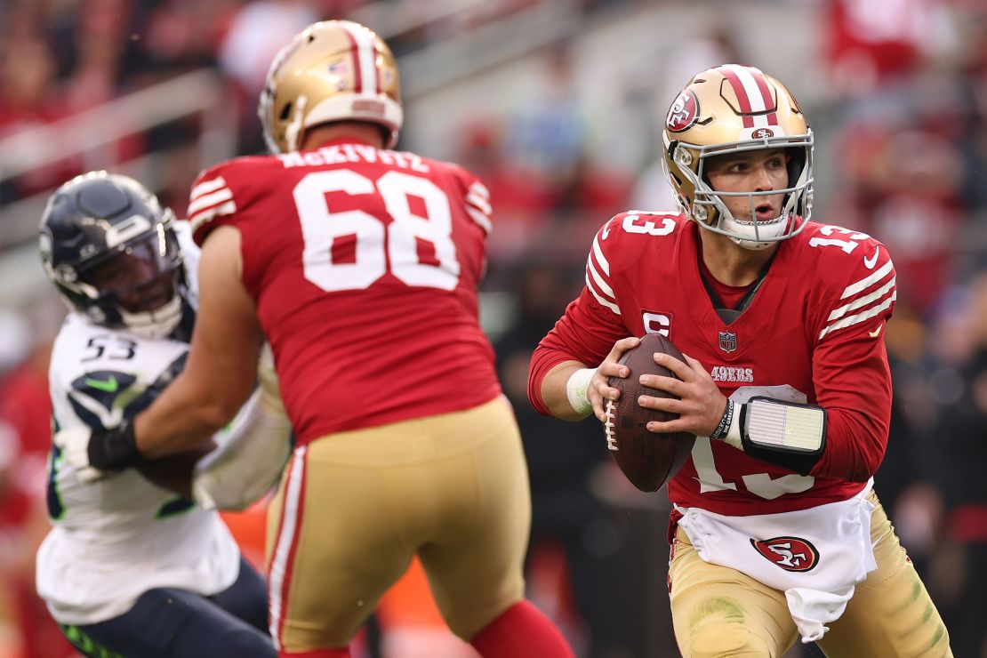 Brock Purdy of the San Francisco 49ers looks to make a pass during a game against the Seattle Seahawks at Levi's Stadium on December 10, 2023 in Santa Clara, California.