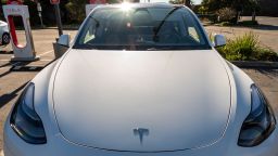 A Tesla vehicle is charged at a Supercharger station in Richmond, California, US, on Wednesday, Dec. 13, 2023.