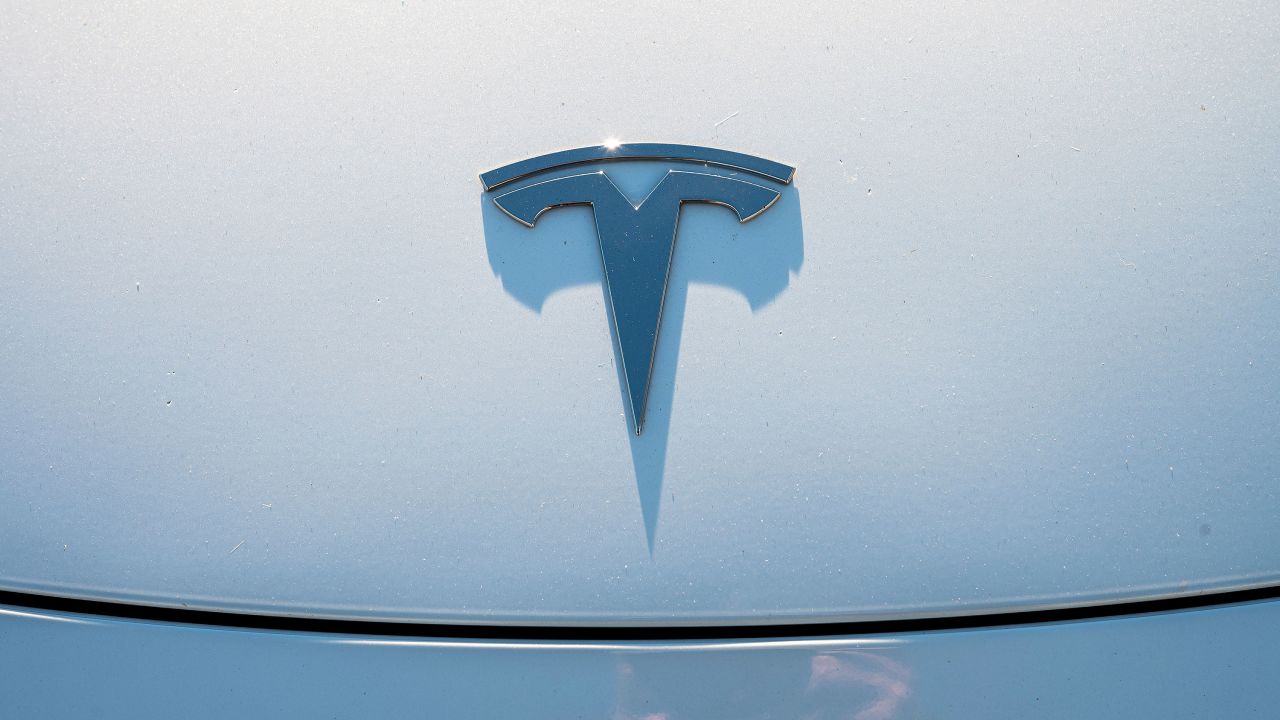 A hood ornament on a Tesla vehicle at a Supercharger station in Richmond, California, US, on Wednesday, Dec. 13, 2023.
