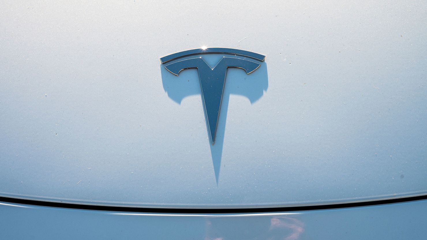 A hood ornament on a Tesla vehicle at a Supercharger station in Richmond, California.