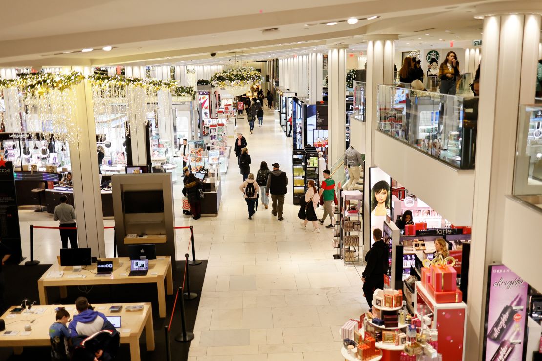 People shop at Macy's in Herald Square, New York, on December 11, 2023.