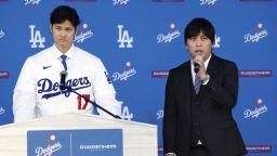 New Los Angeles Dodger Shohei Ohtani (L) attends an introductory press conference with interpreter Ippei Mizuhara on Dec. 14, 2023, at Dodger Stadium in Los Angeles. (Photo by Kyodo News via Getty Images)
