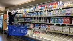 SAN ANSELMO, CALIFORNIA - DECEMBER 12: A customer shops for milk at a grocery store on December 12, 2023 in San Anselmo, California. According to a report by the Bureau of Labor Statistics, inflation slowed in November as consumer prices rose 3.1% compared to year earlier. Prices of grocery staples like milk and eggs continue to decline. (Photo by Justin Sullivan/Getty Images)