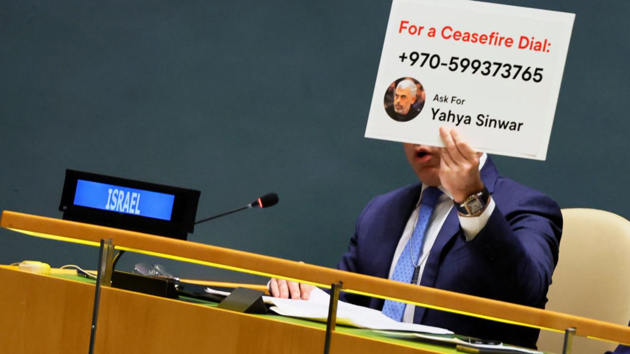 NEW YORK, NEW YORK - DECEMBER 12: Permanent Representative of Israel to the United Nations Gilad Erdan holds up a sign with the contact information of Hamas leader Yahya Sinwar as he speaks during the UN General Assembly emergency special session on the Israel-Hamas war at the United Nations headquarters on December 12, 2023 in New York City. The General Assembly resumed its 45th plenary meeting after Egypt and Mauritania invoked Resolution 377, known as "Uniting for Peace," to demand an immediate humanitarian ceasefire in the two-month-long war between Israel and Hamas after the U.S. vetoed a similar vote in the Security Council. Assembly resolutions are non-binding and could be ignored by Israel even if there is overwhelming support for a ceasefire. The death toll in Gaza has passed 18,000 from Israel's offensive after the Oct. 7 attack by Hamas that Israel says killed 1,200 people and saw 240 people taken hostage.  (Photo by Michael M. Santiago/Getty Images)