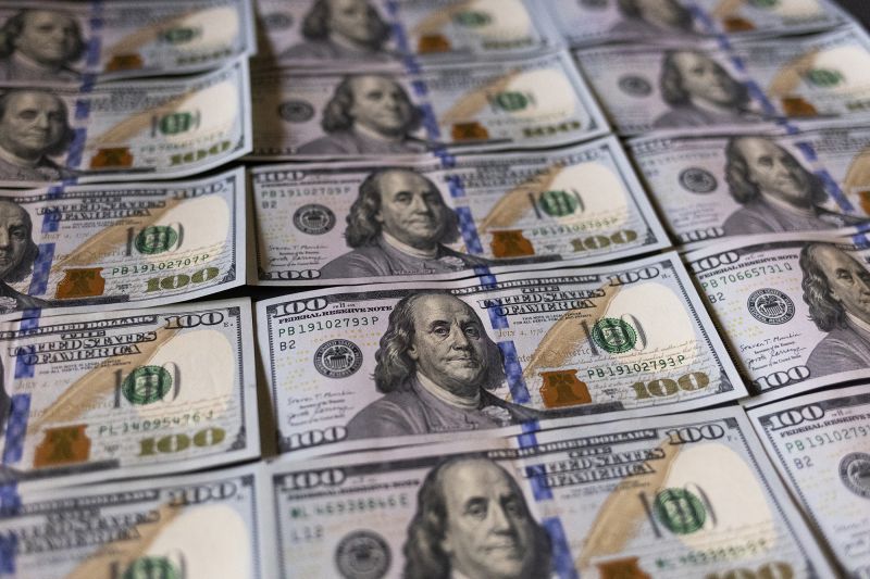 U.S. one hundred dollar bills are being shown in this picture illustration taken in Buenos Aires, Argentina, on December 15, 2023.