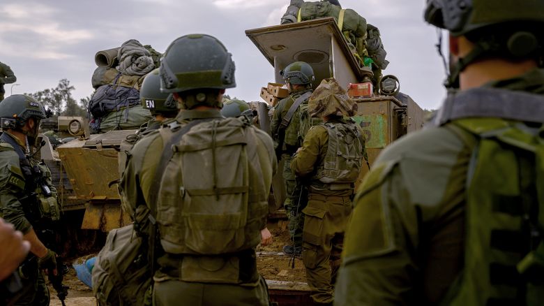 SOUTHERN ISRAEL - DECEMBER 14: Reservists prepare their belongings before entering Gaza at a staging point near the Gaza border on December 14, 2023 in Southern Israel. It has been more than two months since the Oct. 7 attacks by Hamas that prompted Israel's retaliatory air and ground campaign in the Gaza Strip. (Photo by Alexi J. Rosenfeld/Getty Images)