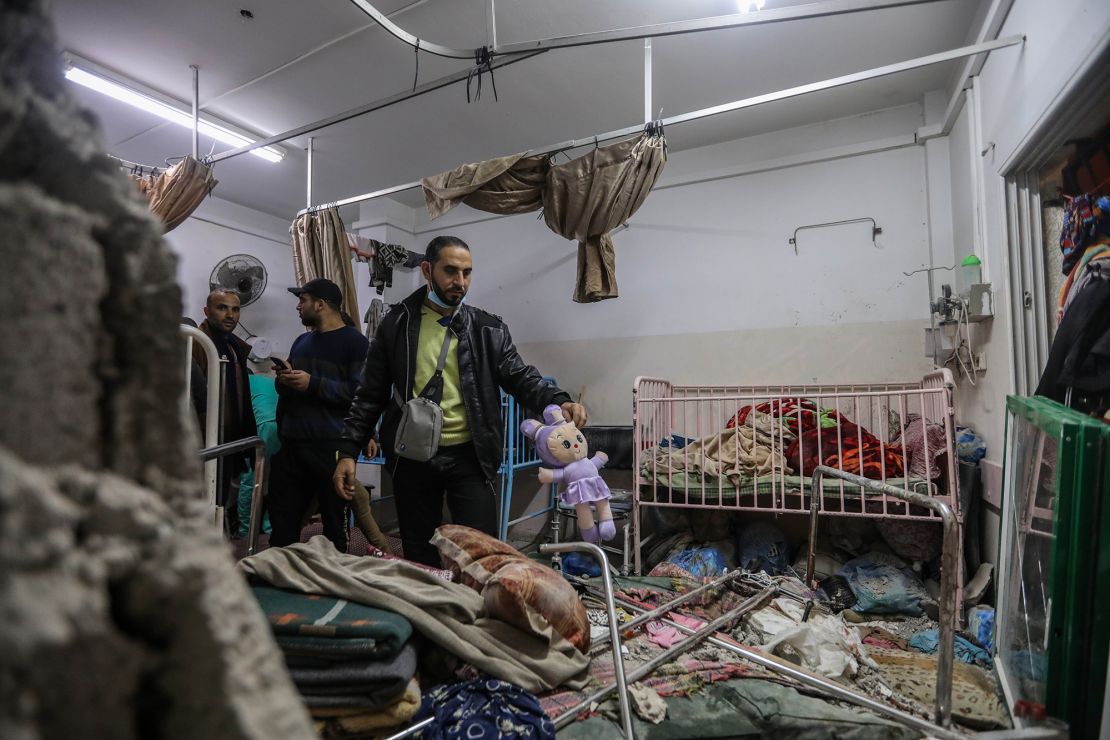 Palestinians survey the damage caused by deadly bombing on the Nasser Medical Complex, on December 17, 2023 in Khan Younis, southern Gaza.