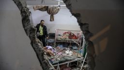 KHAN YUNIS, GAZA - DECEMBER 17: People inspect the damage caused by an artillery shell that hit the maternity hospital inside the Nasser Medical Complex, on December 17, 2023 in Khan Yunis, Gaza. One person was killed and others injured when a shell hit the hospitals children and maternity ward this evening. Fewer than one-third of Gaza's hospitals are functioning in any capacity, and Nasser hospital in Khan Yunis, the Gaza Strip's second-largest city, is inundated with daily with people wounded or killed in airstrikes, as Israel's campaign to defeat Hamas extends into its third month. (Photo by Ahmad Hasaballah/Getty Images)