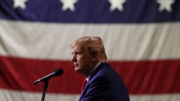 Former President Donald Trump looks on during a campaign rally at the Reno-Sparks Convention Center on December 17, 2023 in Reno, Nevada.