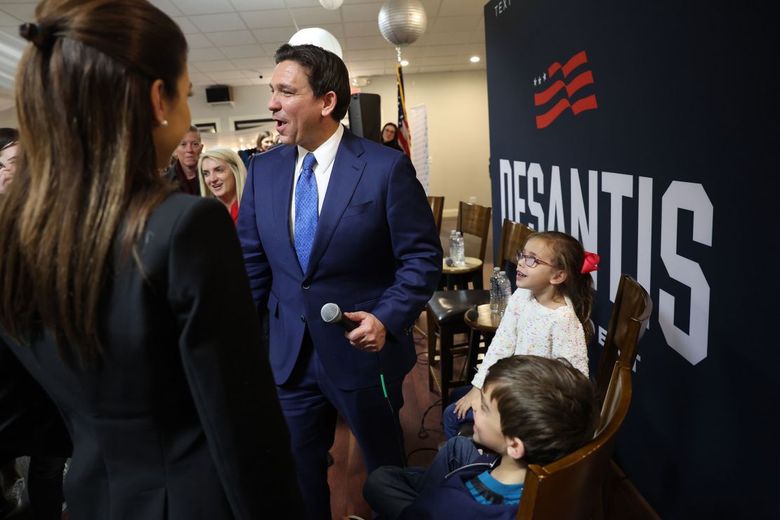 Florida Gov. Ron DeSantis and his family greet guests after speaking at an event in Bettendorf, Iowa, on December 18, 2023.