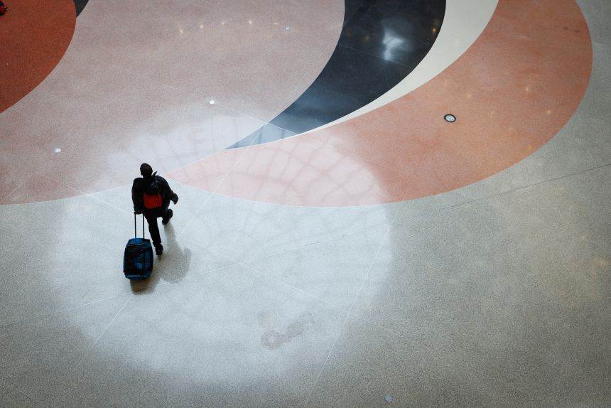 A traveler walks through the main atrium at Hartsfield-Jackson Atlanta International Airport in Atlanta.