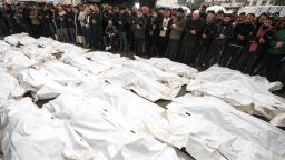 Palestinian mourn their relatives, killed in an overnight Israeli strike on the Al-Maghazi refugee camp, during a mass funeral at the Al-Aqsa hospital in Deir Al-Balah, in the central Gaza Strip, on December 25, 2023, amid ongoing battles between Israel and the Palestinian militant group Hamas.