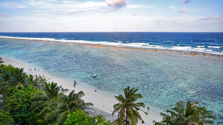 A general view shows people at a beach in Hulhumale on December 26, 2023.