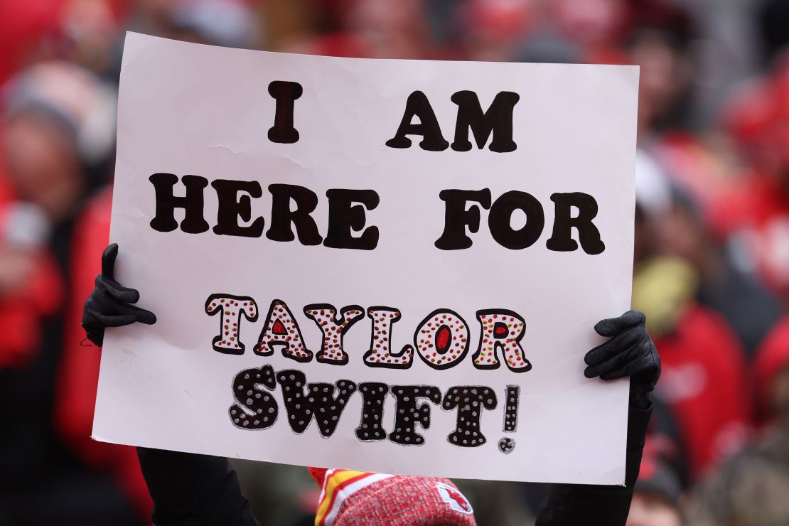 Fans display signs in support of Taylor Swift during a Raiders-Chiefs football game in Kansas City in December.