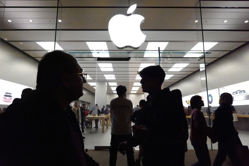 People walk past the Apple store in the Americana at Brand shopping center on the day after Christmas on December 26, 2023 in Glendale, California. U.S. retail sales rose 3.1 percent year over year this holiday season, based on in-store and online purchases, according to Mastercard SpendingPulse.