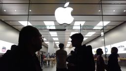 People walk past the Apple store in the Americana at Brand shopping center on the day after Christmas on December 26, 2023 in Glendale, California.