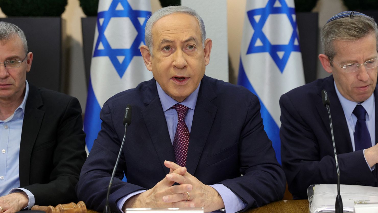 Israeli Prime Minister Benjamin Netanyahu, center, chairs a cabinet meeting at the Kirya, which houses the Israeli Ministry of Defense, in Tel Aviv on December 31.