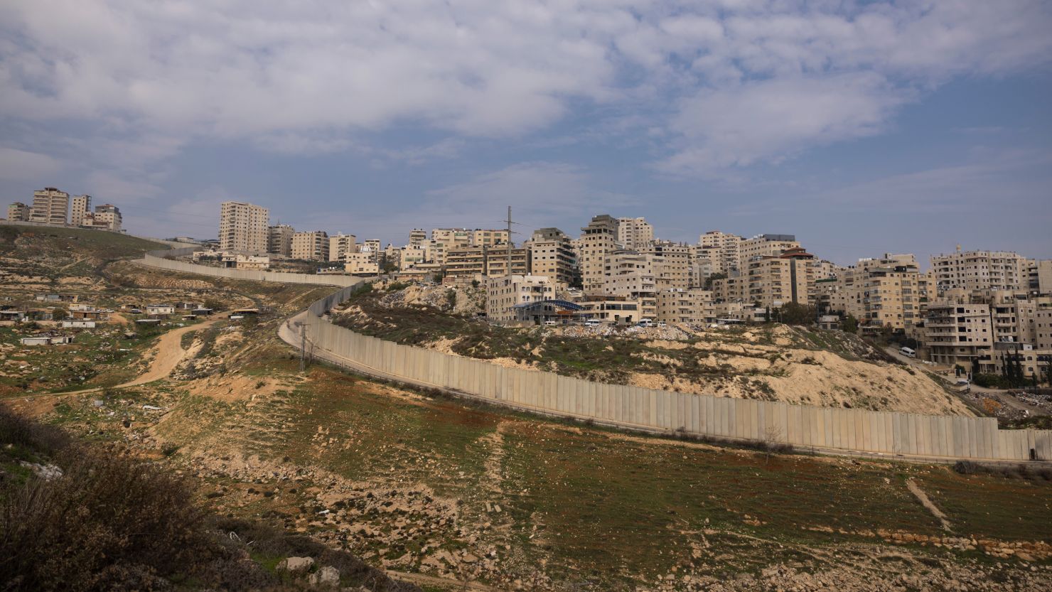 The separation barrier on the outskirts of the east Jerusalem refugee camp of Shuafat, pictured on December 28, 2023.