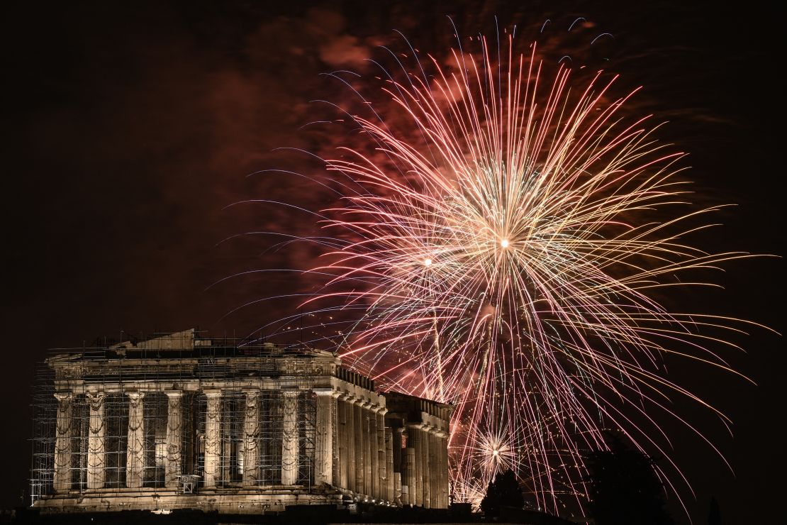 TOPSHOT - Fireworks explode over the Acropolis during New Year celebrations in Athens, early on January 1, 2024. (Photo by Angelos TZORTZINIS / AFP) (Photo by ANGELOS TZORTZINIS/AFP via Getty Images)