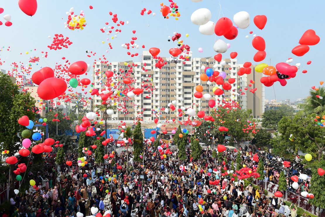 Christians release balloons during New Year celebrations at a church in Ahmedabad on January 1, 2024.