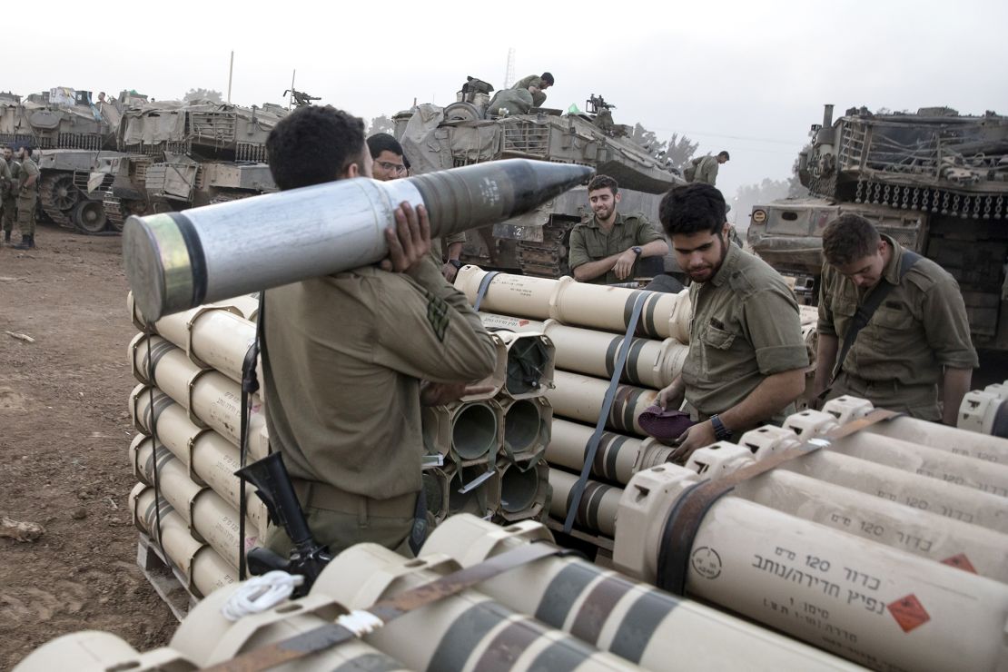 Israeli soldiers organize tank shells after returning from the Gaza Strip at the southern border, Israel on January 1.