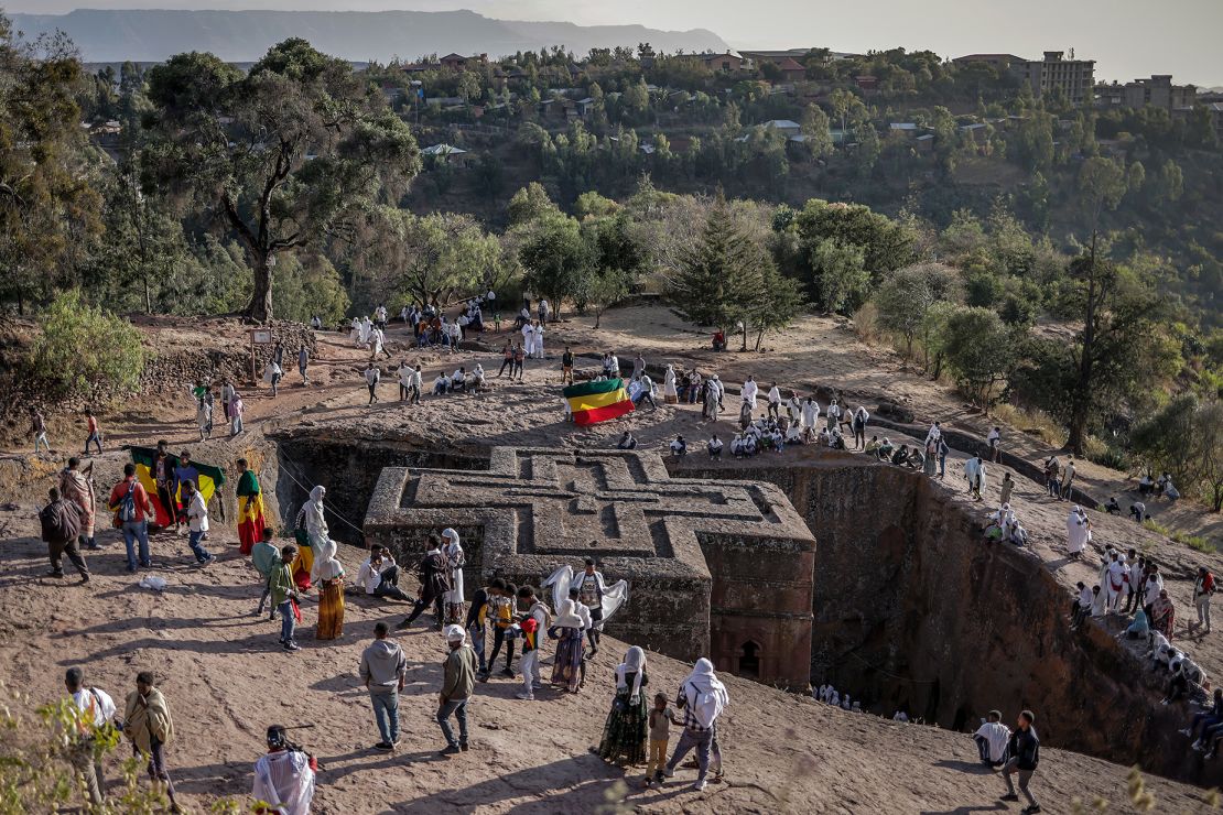 Ethiopian Orthodox worshippers gather next to a rock-hewn church in Lalibela, a UNESCO World Heritage Site, on January 7, 2024.
