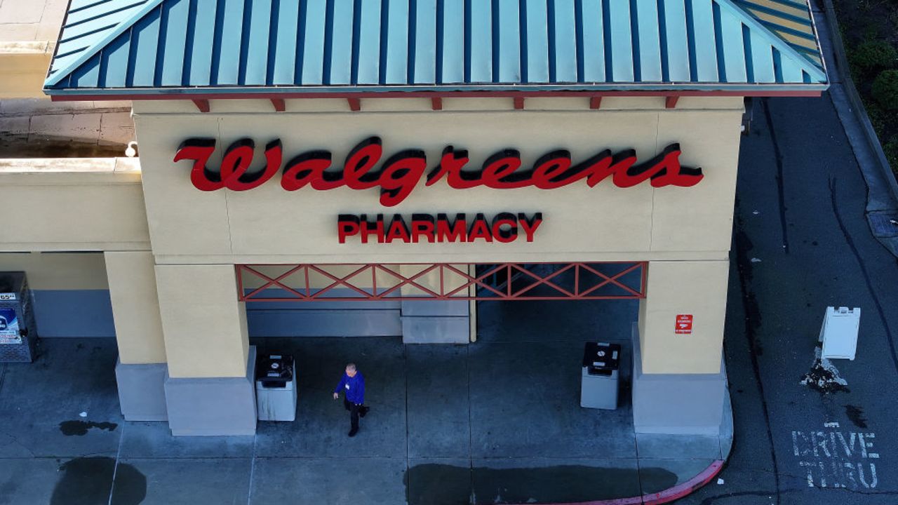 SAN PABLO, CALIFORNIA - JANUARY 04: In an aerial view, a customer leaves a Walgreens store on January 04, 2024 in San Pablo, California. Shares of Walgreens stock fell sharply after the company reported better-than-expected first quarter earnings but plans to cut its quarterly dividend nearly in half. (Photo by Justin Sullivan/Getty Images)