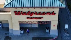 SAN PABLO, CALIFORNIA - JANUARY 04: In an aerial view, a customer leaves a Walgreens store on January 04, 2024 in San Pablo, California. Shares of Walgreens stock fell sharply after the company reported better-than-expected first quarter earnings but plans to cut its quarterly dividend nearly in half. (Photo by Justin Sullivan/Getty Images)