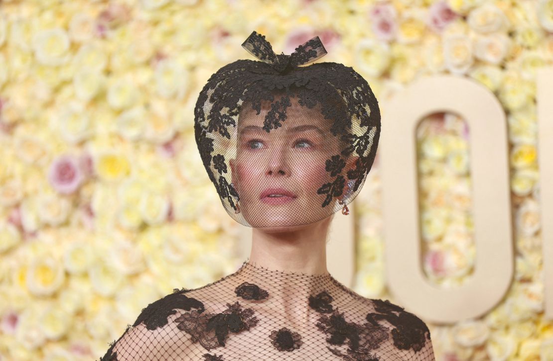 "Saltburn” actress Rosamund Pike’s decision to match her lacy black Fall 2019 Dior couture dress with a veiled fascinator by Philip Treacy came about following a recent skiing accident. "My face was entirely smashed up and I thought, 'I need to do something',” she told the red carpet pre-show presenter Marc Malkin. “Actually, it's healed, but I fell in love with the look.”