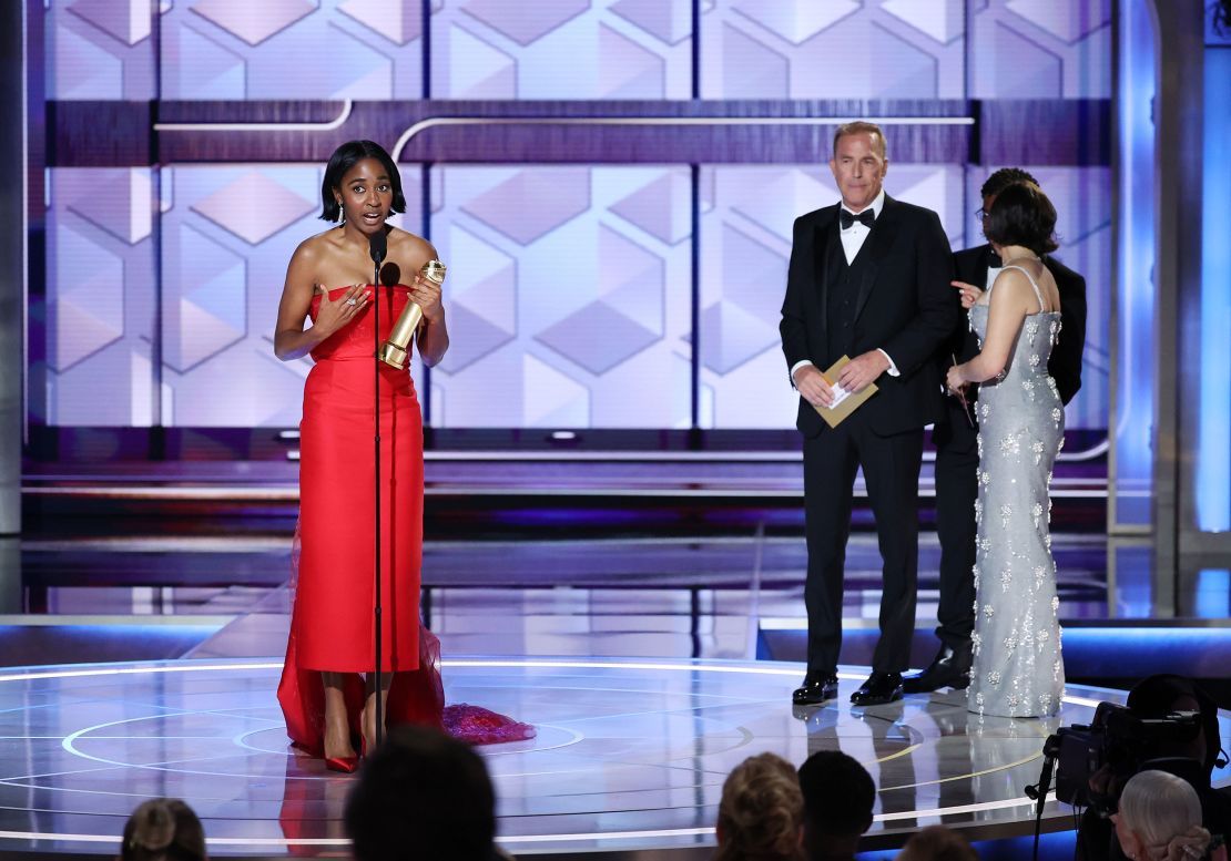 (From left) Ayo Edebiri and Kevin Costner on the 2024 Golden Globes stage in Beverly Hills.