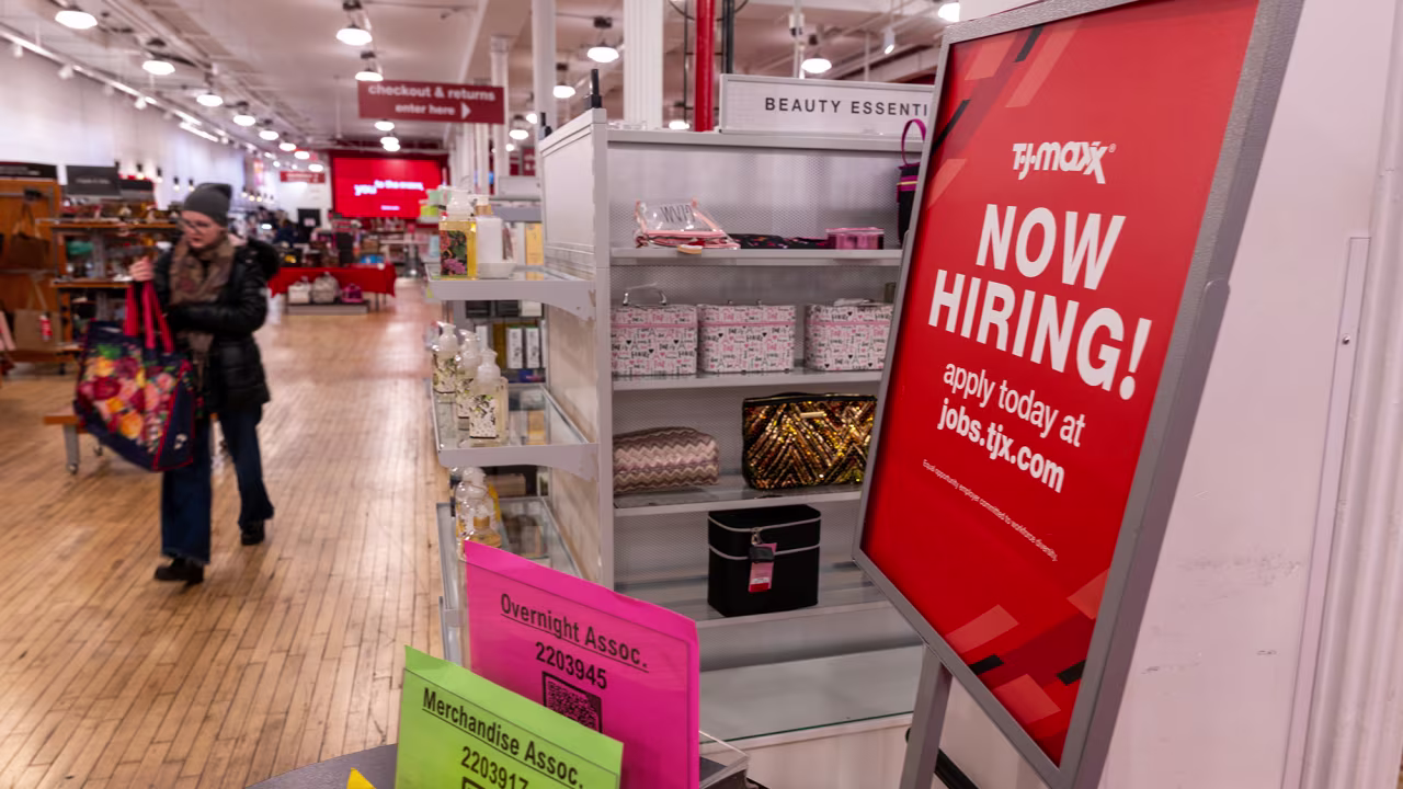 A 'now hiring' sign is displayed in a retail store in Manhattan on January 5 in New York City.