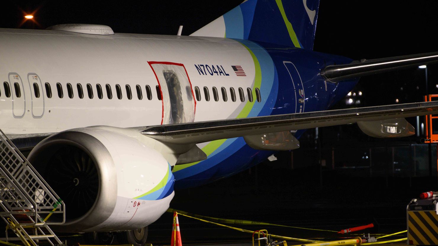 A plastic sheet covers an area of the fuselage of the Alaska Airlines Boeing 737 MAX 9 aircraft.