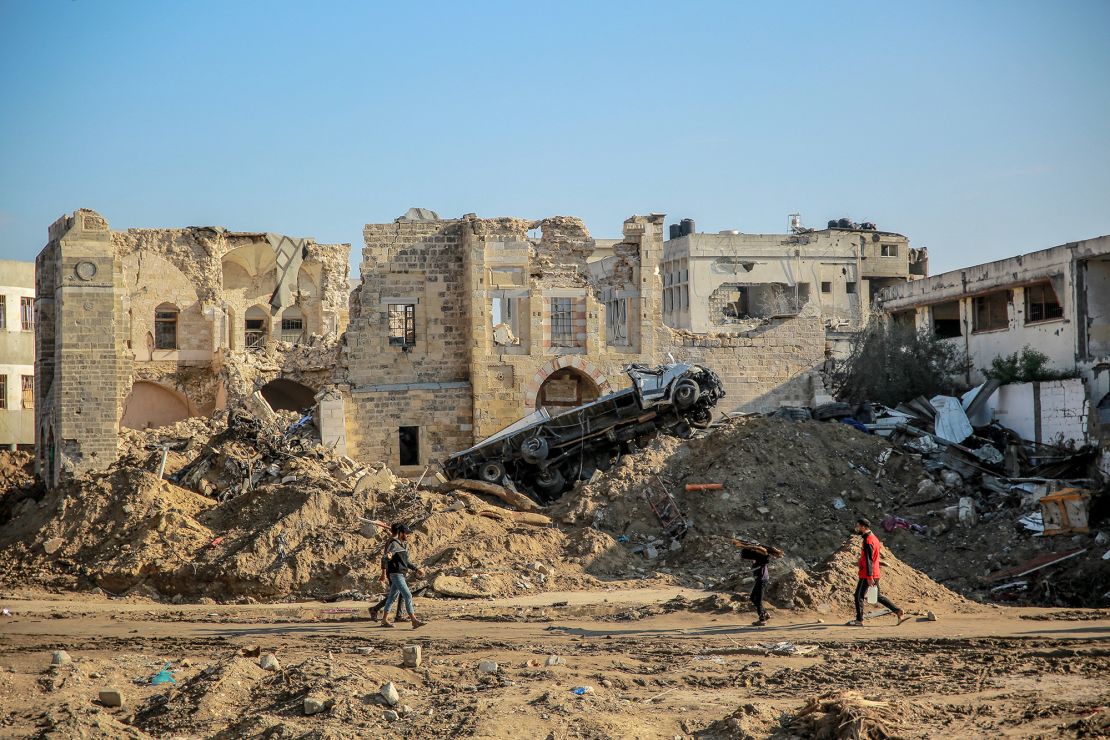 People walk in front of Gaza City's 17th century Qasr al-Basha, or the Pasha's Palace, on January 5, 2024.